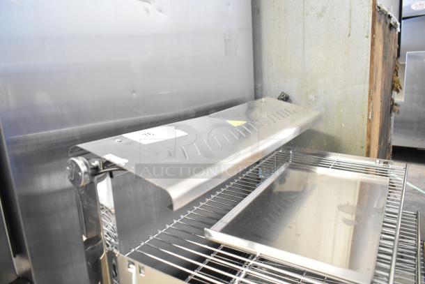 ServIt 423HDM26SA 26" heated display case, 3 shelves, sliding doors, visible dent, broken glass. 120V, 1 Phase.