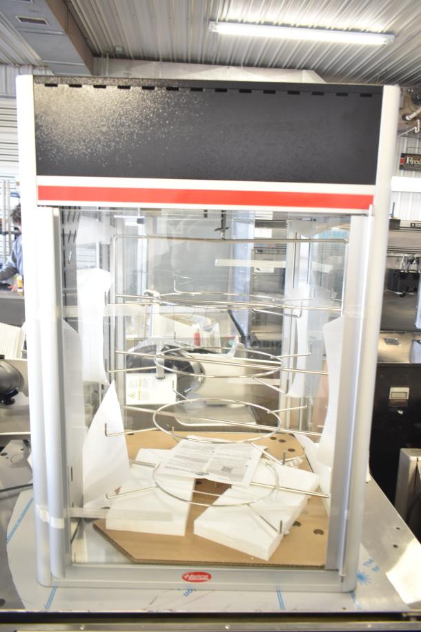 Hatco FSDT-2 Flav-R-Savor display cabinet with four-tier circle rack, two doors, 120V, 1-phase, excellent condition.