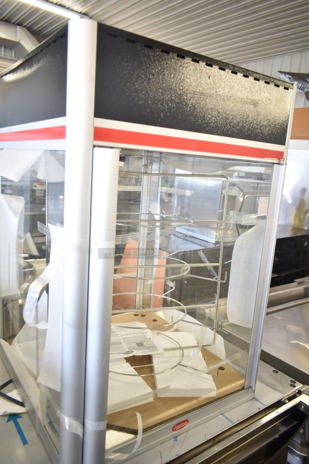 Hatco FSDT-2 Flav-R-Savor display cabinet with four-tier circle rack, dual doors, in excellent condition. 120 volts, 1 phase.