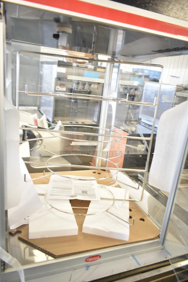 Hatco FSDT-2 Flav-R-Savor cabinet with four-tier circle rack and motor, two-door, 120V, 1 phase, in good condition.