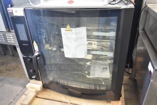 Brand new 2022 Alto Shaam AR-7T electric rotisserie oven, 380-415V, 1 phase, 7 spits, visible labels and manual included.
