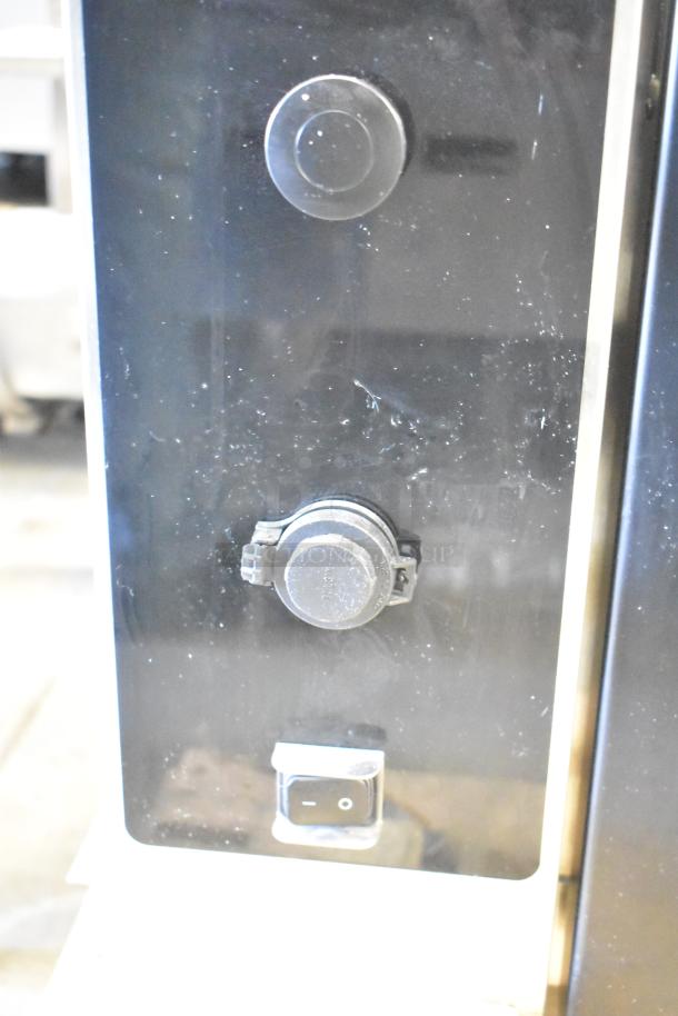 Brand new 2022 Alto Shaam AR-7T Commercial Rotisserie Oven control panel close-up. Features dials and power switch.