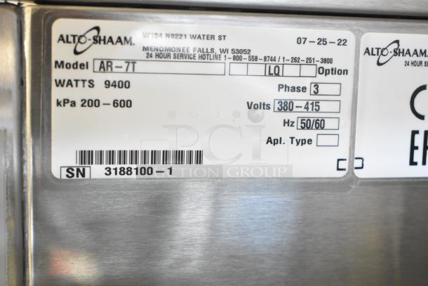 Alto Shaam AR-7T commercial rotisserie oven label showing model, voltage, wattage, and serial number details.