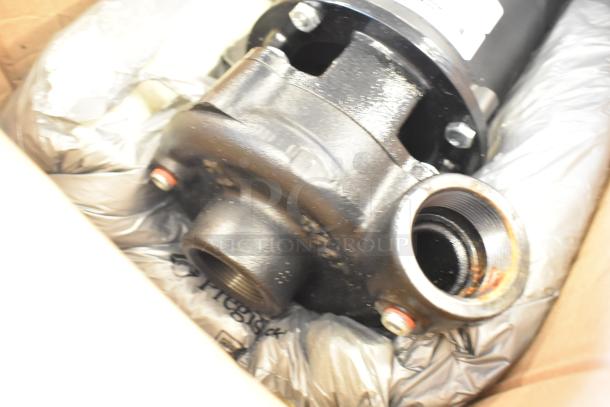 BRAND NEW SCRATCH AND DENT Weg 13528748 Motor, 230/460V, 3 Phase, black finish, visible mounting points, boxed condition.