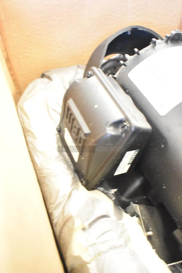 BRAND NEW SCRATCH AND DENT Weg 13528748 Motor, 230/460V, 3 Phase, in packaging, minor cosmetic damage visible.