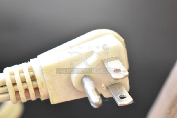Close-up of a power plug from the Ice-O-Matic ICEU220HA1 ice machine. Plug shows standard three-prong design.
