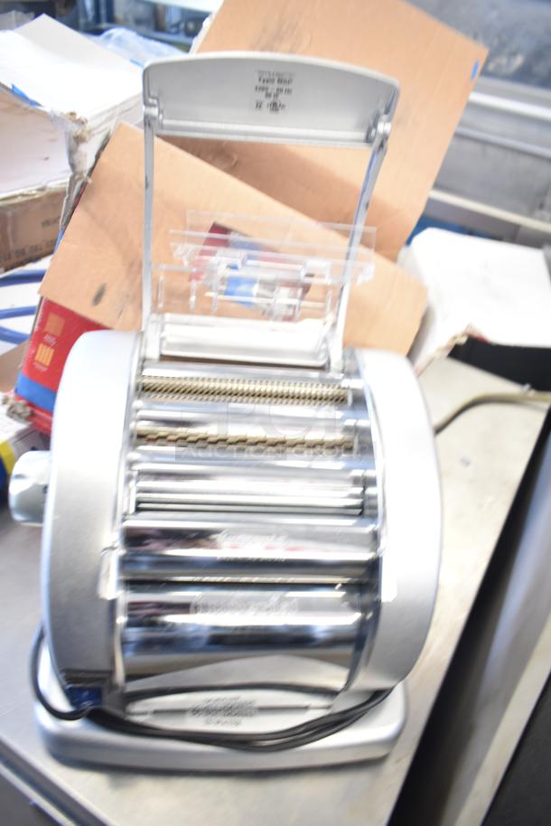 BRAND NEW Imperia NSP countertop pasta machine, electric, 120 volts, 1 phase, slight cosmetic dents, visible labels.