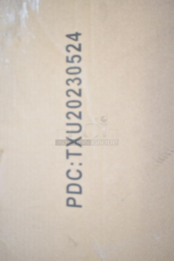 Cardboard box with markings: "PDC: TXU20230524" indicating packaging for Flash Furniture patio table.