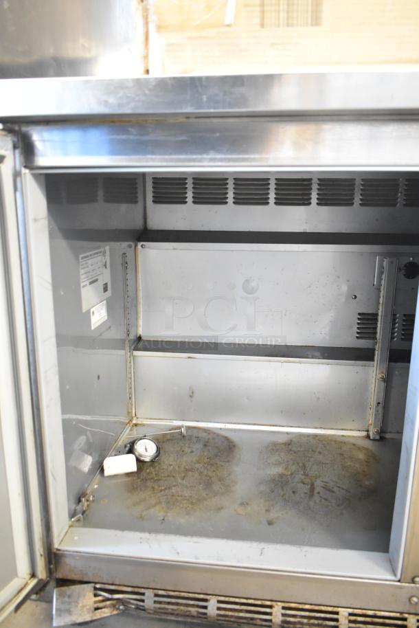Beverage Air WTR72AY 3-door undercounter cooler, 115V, steel, interior view, used condition with thermometer inside.