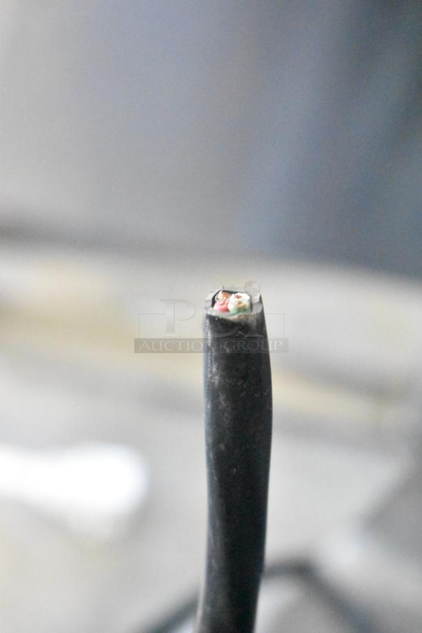 Cropped image showing the end of an electrical cord for the Pulse ULG30BSSF-5 cooler, exposing internal wires.