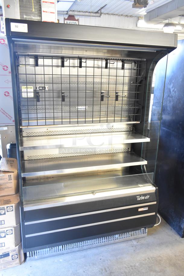 Turbo Air TOM-50B 51" black refrigerated air curtain merchandiser, 120V, 1 Phase, with glass front and metal shelves.