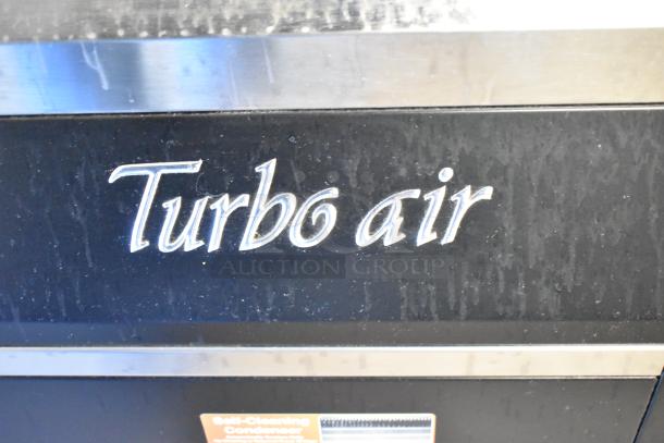 Turbo Air TOM-50B black refrigerated air curtain merchandiser, 51", featuring brand logo and self-cleaning condenser label.