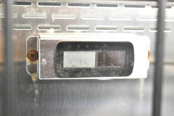 Turbo Air TOM-50B display panel with rusted screws, showing wear. Model label indicates 120 volts, 1 phase power.