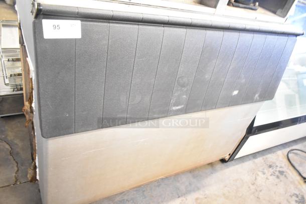 Hoshizaki KM-1301SWH commercial ice machine head on ice bin, 208-230 volts, 1 phase. Visible wear, auction lot tag 95.