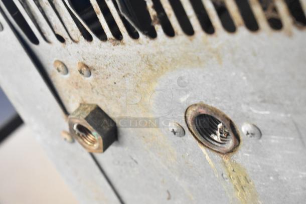 Hoshizaki KM-1301SWH commercial ice machine head detail, showing metal components and signs of wear.