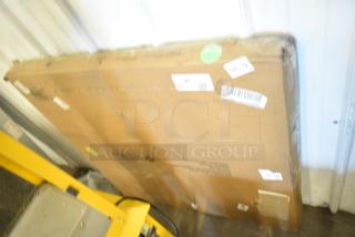 Brand new but scratch and dent Lancaster 36" x 36" MDF table top, black wood finish, in original packaging with visible labels.