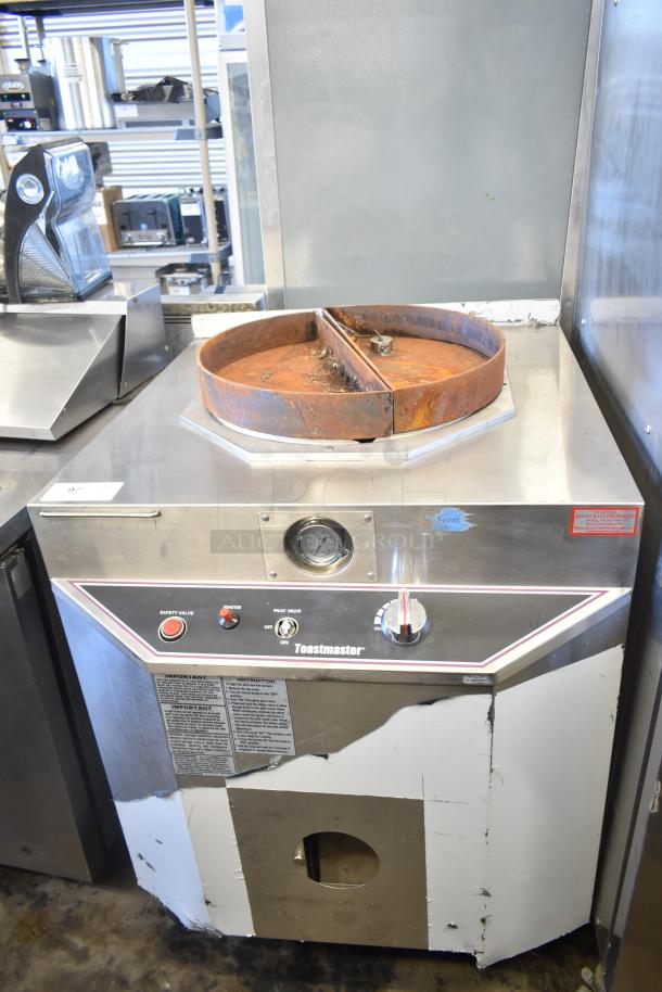 Toastmaster TCT-1627 R commercial tandoor oven, 85,500 BTU, natural gas, ceramic, worn condition, visible safety labels.