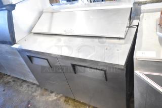 True TSSU-48-12 commercial sandwich prep table with bain marie mega top, on casters, stainless steel, 115 volts, 1 phase.