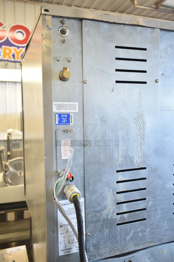 2023 Ice-O-Matic CIM1446HR6 ice machine head with visible labels on a 2023 Ice-O-Matic B110PSB bin. 208-230V, 1 Phase.