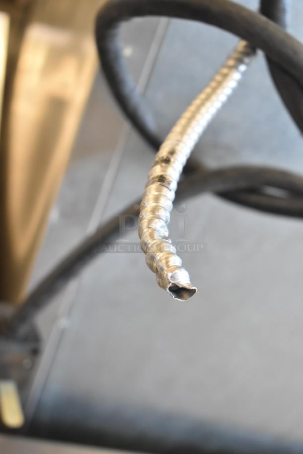 Ice-O-Matic CIM1446HR6 ice machine head on B110PSB bin, 208-230V, 1 phase. Coiled hose detail, commercial use.