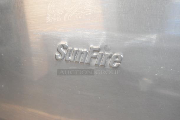 Garland SunFire gas 10-burner range with 2 ovens, over shelf, backsplash; commercial-grade, logo embossed on stainless steel.