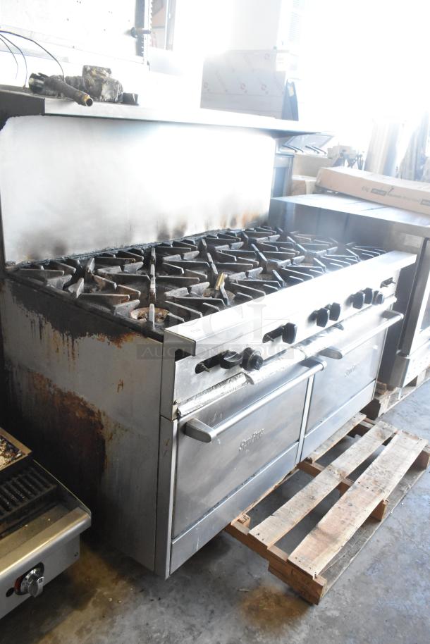 Garland SunFire commercial gas range with 10 burners, 2 ovens, over shelf, and back splash. Signs of wear, used condition.