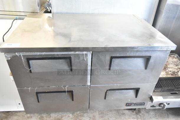 True TUC-48D-4 commercial 4-drawer undercounter cooler on casters, 115 Volts, 1 Phase. Stainless steel, signs of wear.