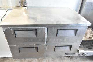 True TUC-48D-4 commercial 4-drawer undercounter cooler on casters, 115 Volts, 1 Phase. Stainless steel, signs of wear.