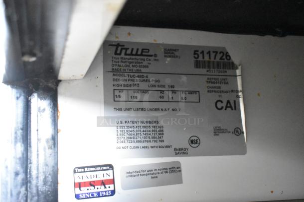 True TUC-48D-4 commercial cooler tag, showing model, voltage, phase, and refrigerant details; made in the USA.