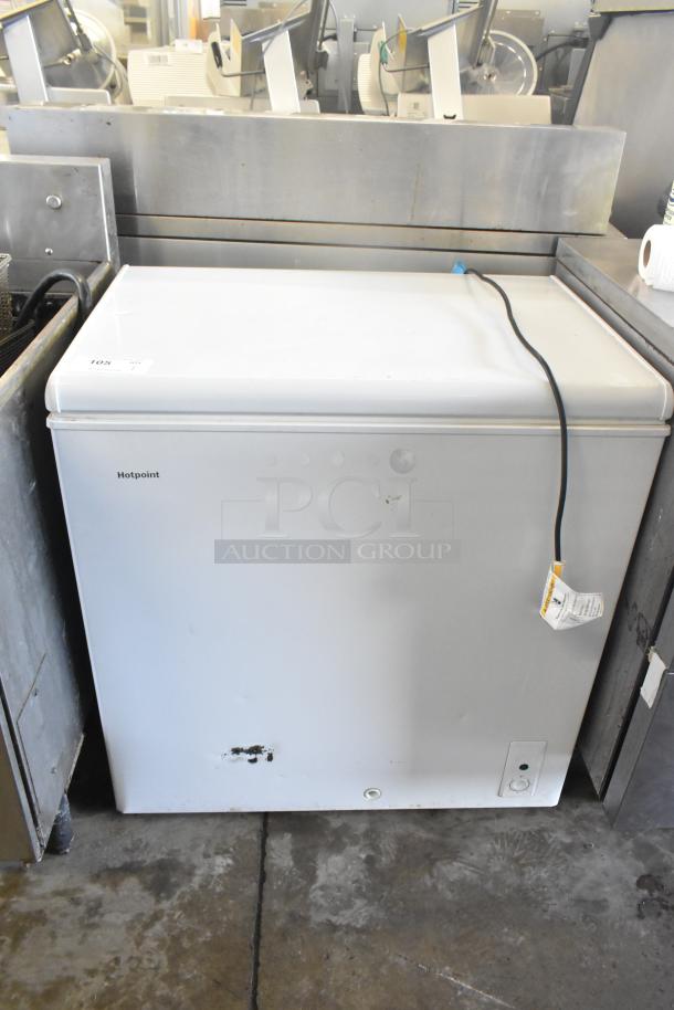 Hotpoint HHM7SRBWW chest freezer, 115V, 1 Phase, minor wear visible, white exterior, model label on front.