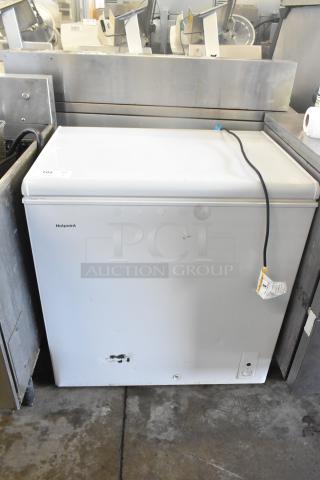 Hotpoint HHM7SRBWW chest freezer, 115V, 1 Phase, minor wear visible, white exterior, model label on front.