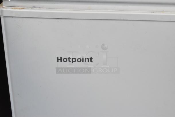 Hotpoint HHM7SRBWW chest freezer, 115 volts, 1 phase, white exterior, visible brand logo. Good condition.