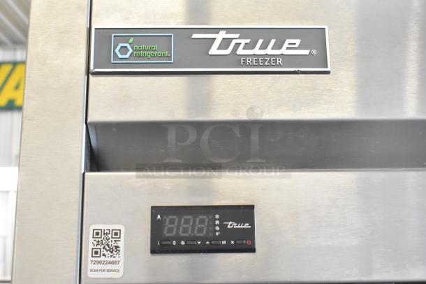 2018 True T-23F-HC commercial freezer, natural refrigerant, digital display, tags visible, 115V, 1 Phase, on casters.