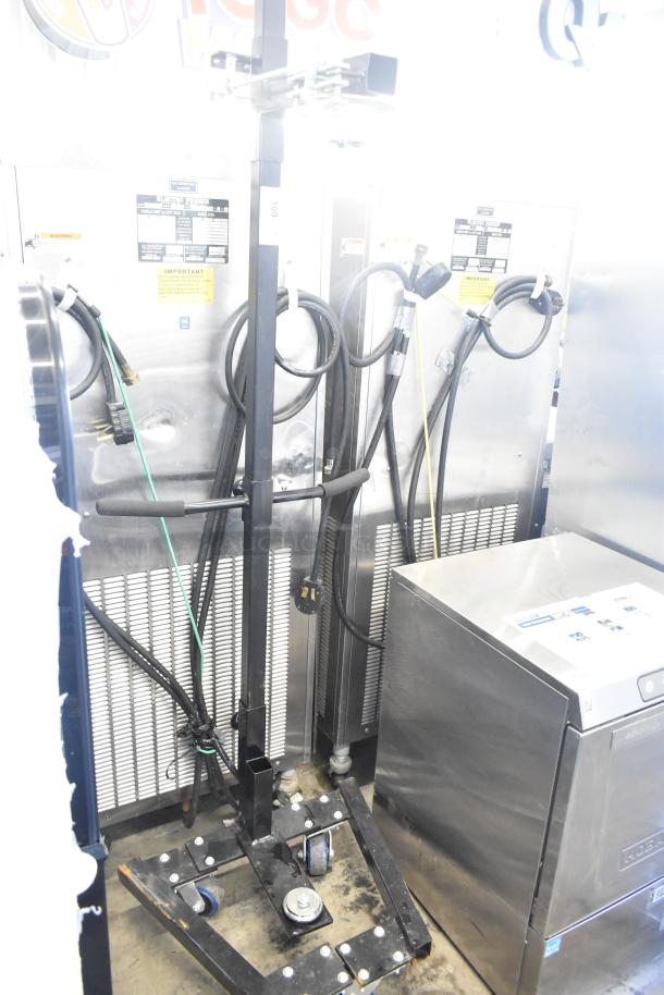 Fantom Full Web Portable Shrink Wrapping Station, featuring durable metal frame, hose attachments, and control panel. Good condition.