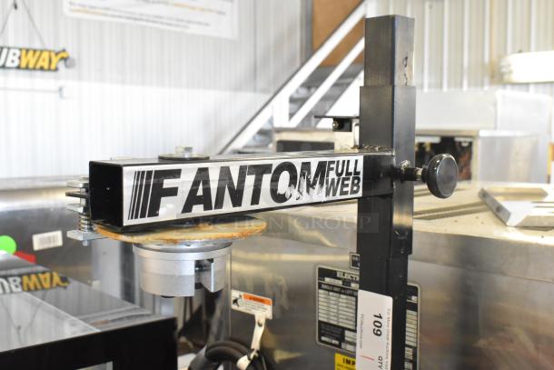 Fantom Full Web Portable Shrink Wrapping Station, black metal, visible logo. Good condition, with attachment arms.