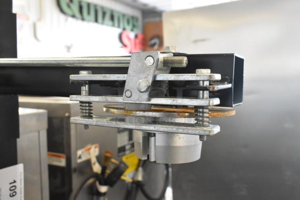 Fantom Full Web Portable Shrink Wrapping Station, metal components, adjustable mechanism, visible springs, used condition.