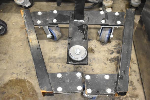 Fantom Full Web Portable Shrink Wrapping Station base with caster wheels, black metal frame, and bolt fastenings, in used condition.