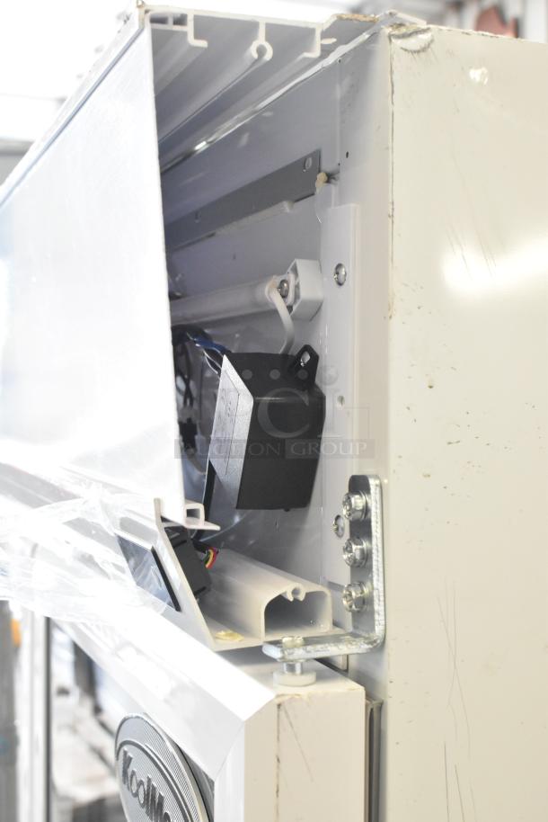 BRAND NEW KoolMore KM-MDR-2GD-35 cooler, two glass doors, commercial casters, visible wiring and minor scratches, 115V.