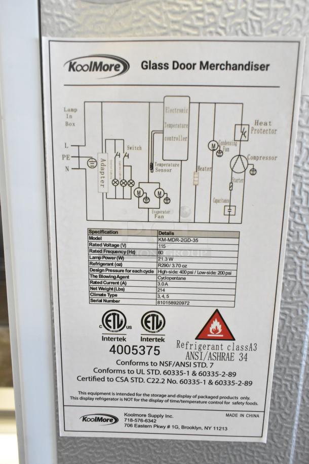 KoolMore KM-MDR-2GD-35, 2-door reach-in cooler with casters, 115V, new scratch and dent. Label details specs and certifications.