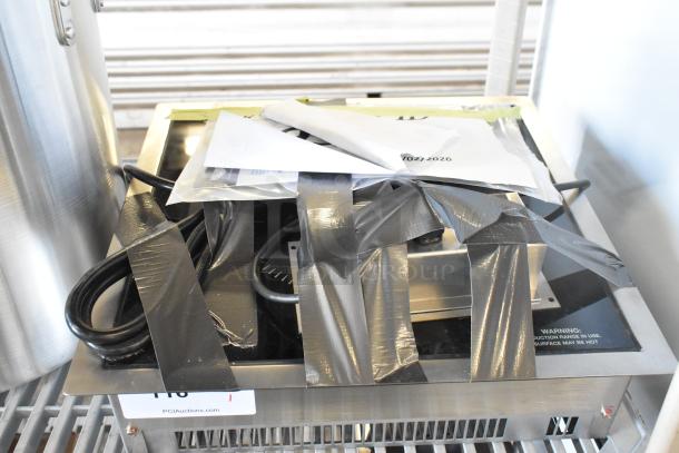 Brand new Vollrath 69505 Ultra Series induction cooker, 208/240V, 1 phase. Scratch and dent; taped packaging visible.