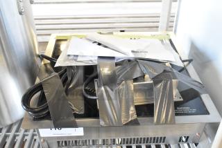 Brand new Vollrath 69505 Ultra Series induction cooker, 208/240V, 1 phase. Scratch and dent; taped packaging visible.