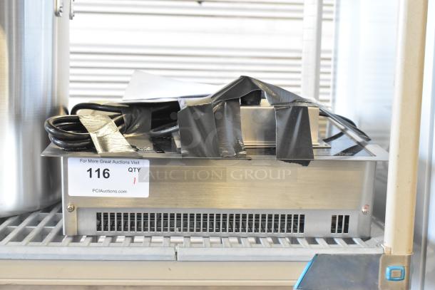 Brand new Vollrath 69505 induction cooker, drop-in model, 208/240V, 1 phase, scratch and dent condition, auction tag visible.