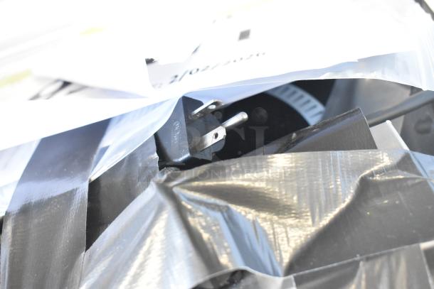 BRAND NEW Vollrath 69505 induction cooker, 208/240V, 1 Phase, wrapped in packaging with visible power plug.