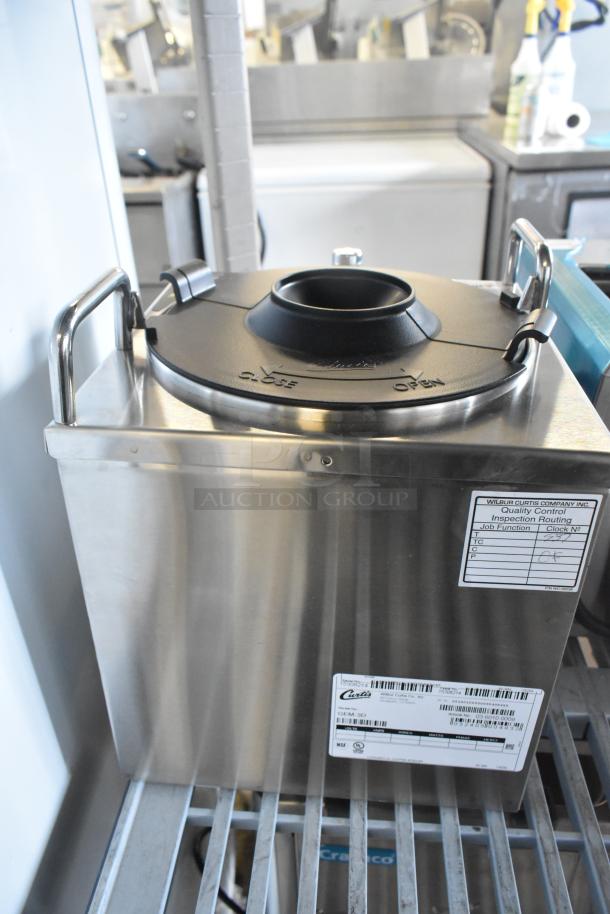 Brand new Curtis GEM-3D 1.5-gallon satellite coffee server with decaf faucet, scratch and dent condition, labels visible.