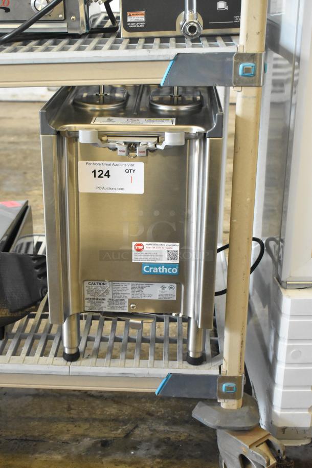 Brand new Crathco CS-1D/2E-16-290 drink dispenser base, no hoppers, 120V, 1 phase, stainless steel, minor scratches, auction label attached.