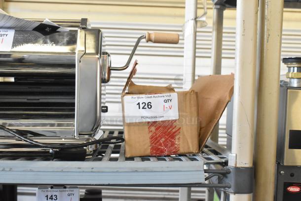 Lot of Zebra unit with 3 batteries, includes packaging. Visible auction sticker: Item 126, PCI Auctions.