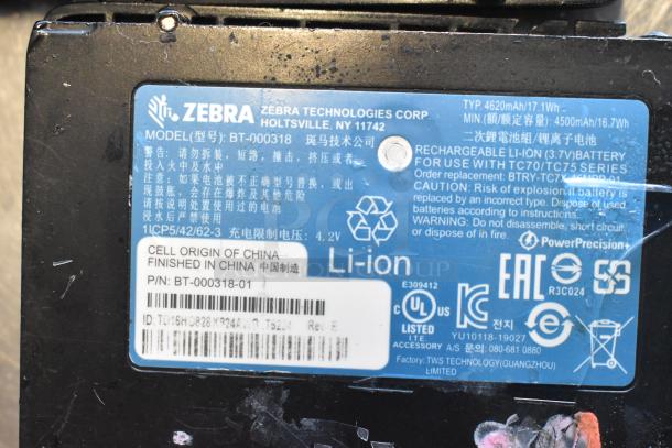 Zebra unit model BT-000318 with 3 batteries; 4620mAh, 3.7V Li-ion, for TC70/TC75 series. Marked "Finished in China."