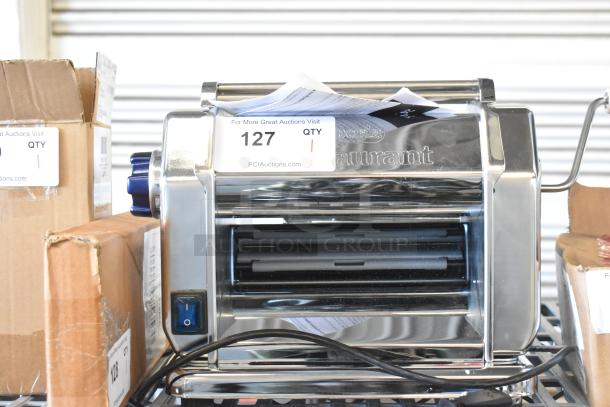 Brand new Imperia 915PM038 electric stainless steel pasta machine, 8 1/4", 120V, with slight scratches. Auction tag #127.