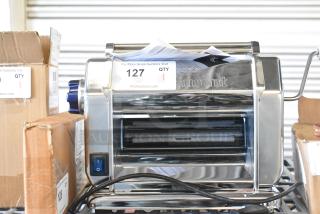 Brand new Imperia 915PM038 electric stainless steel pasta machine, 8 1/4", 120V, with slight scratches. Auction tag #127.