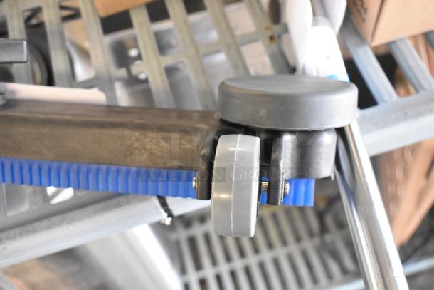 Brand new vacuum attachment, scratch and dent, features grey and blue components, roller wheel for easy maneuverability.